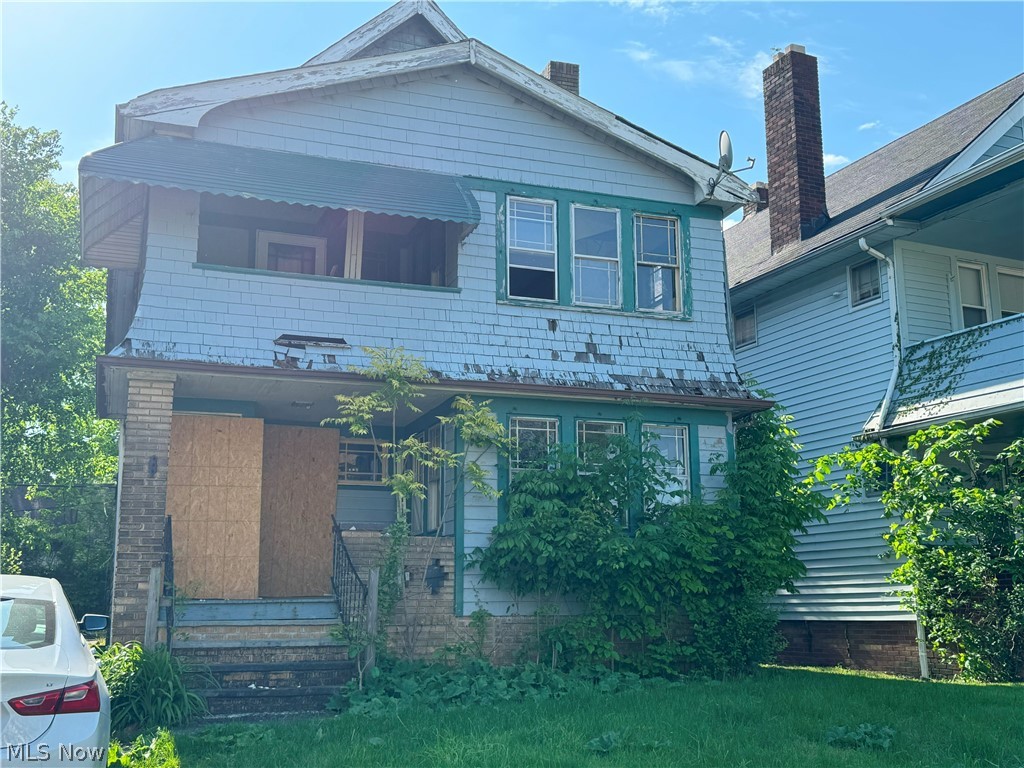 View of front of house featuring a balcony