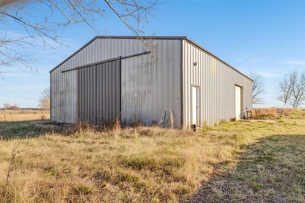 109 Private Road Brookston, TX 75421 - Photo 3 of 26 a view of wooden fence