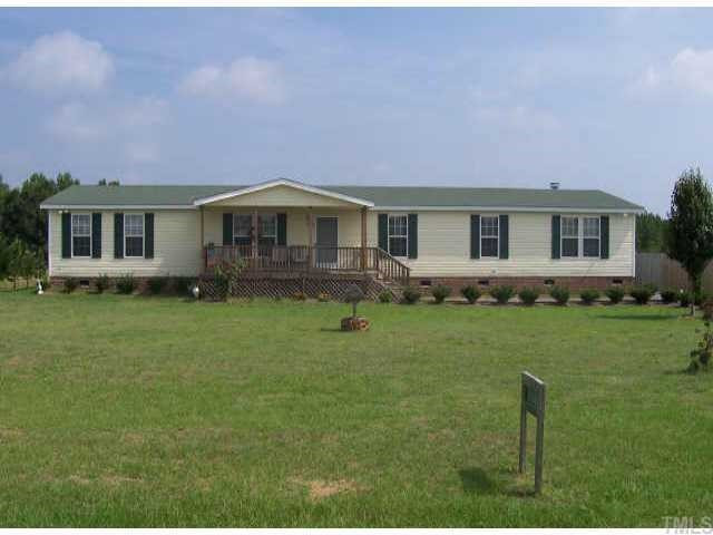 2168 Elevation Road Four Oaks, NC 27524 - Photo 1 of 9 Front view with rocking chair front porch Exterior Front
