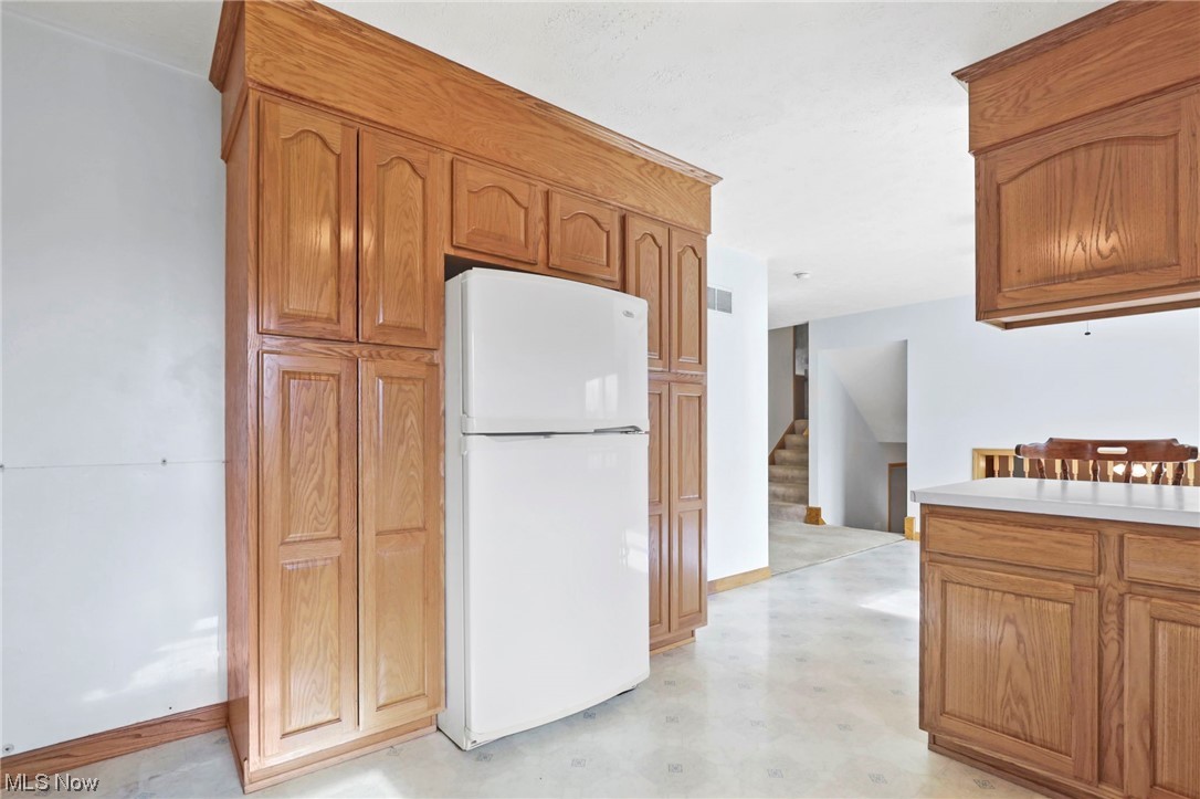 411 Adario West Road Shiloh, OH 44878 - Photo 8 of 35 Kitchen with white refrigerator