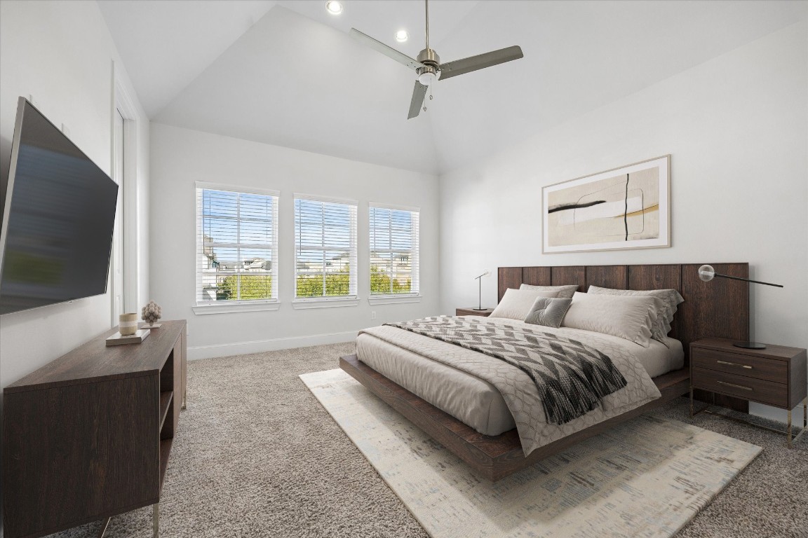 9663 Kings Cross Station Houston, TX 77045 - Photo 13 of 30 a spacious bedroom with a large bed and a flat screen television