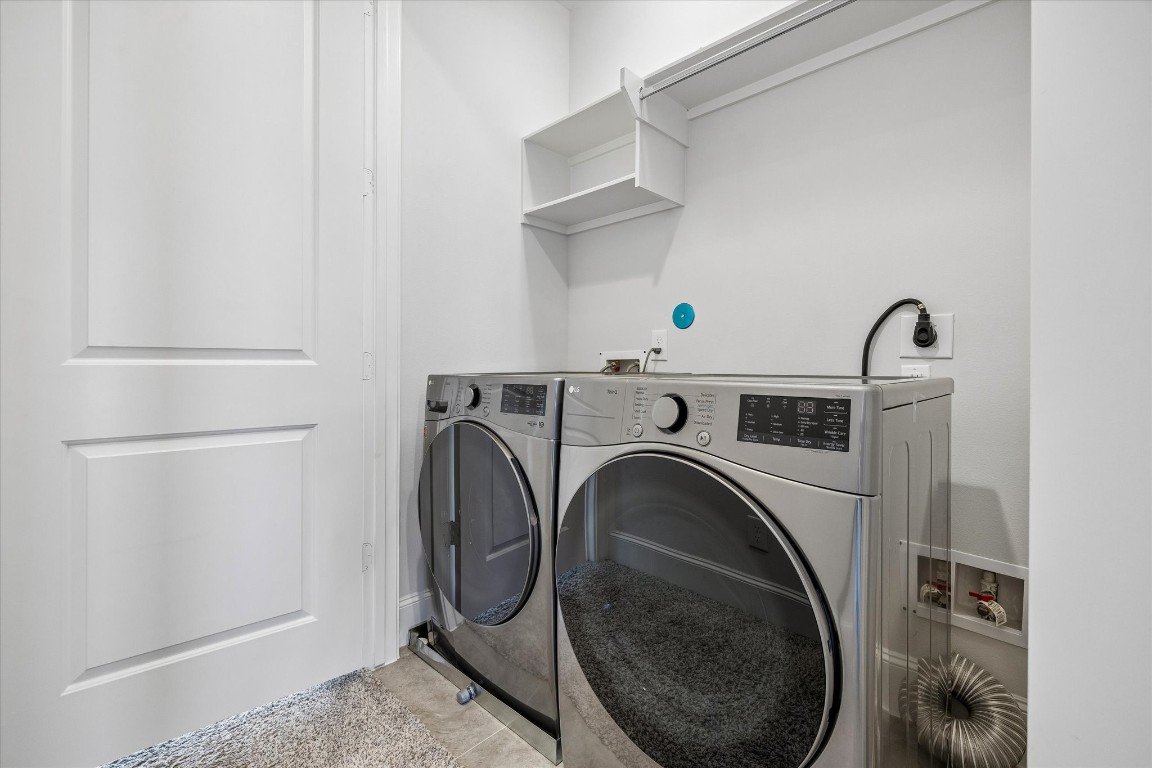 9663 Kings Cross Station Houston, TX 77045 - Photo 18 of 30 a utility room with dryer and washer