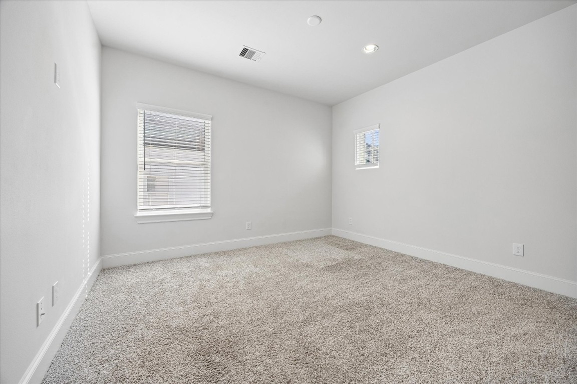 9663 Kings Cross Station Houston, TX 77045 - Photo 19 of 30 an empty room with windows