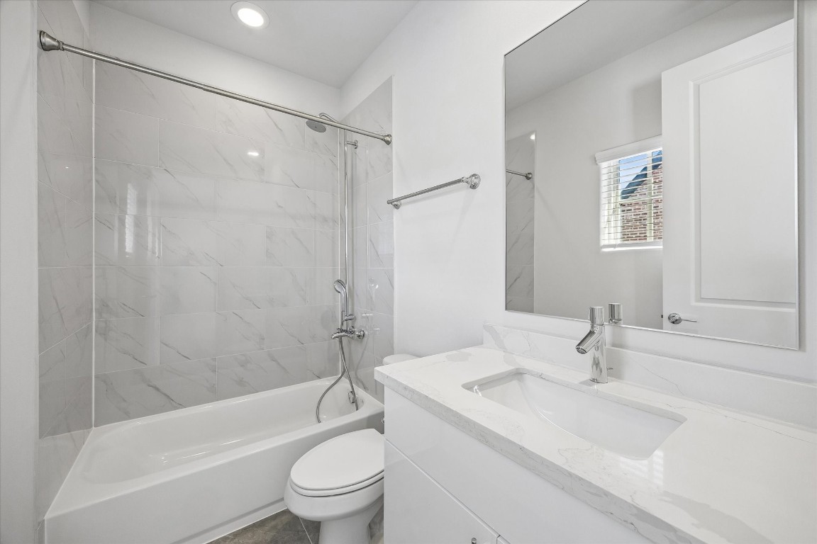 9663 Kings Cross Station Houston, TX 77045 - Photo 20 of 30 a bathroom with a sink toilet and shower