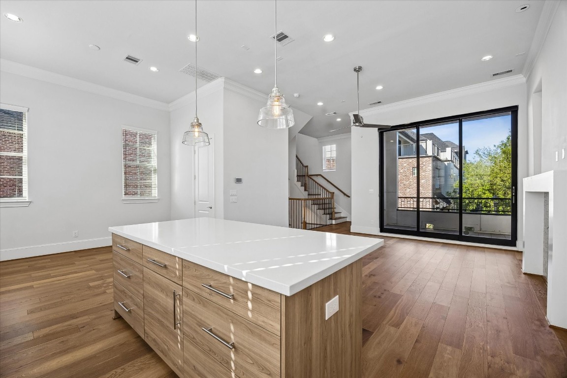 9663 Kings Cross Station Houston, TX 77045 - Photo 6 of 30 a open kitchen with stainless steel appliances granite countertop a refrigerator a sink and wooden floor