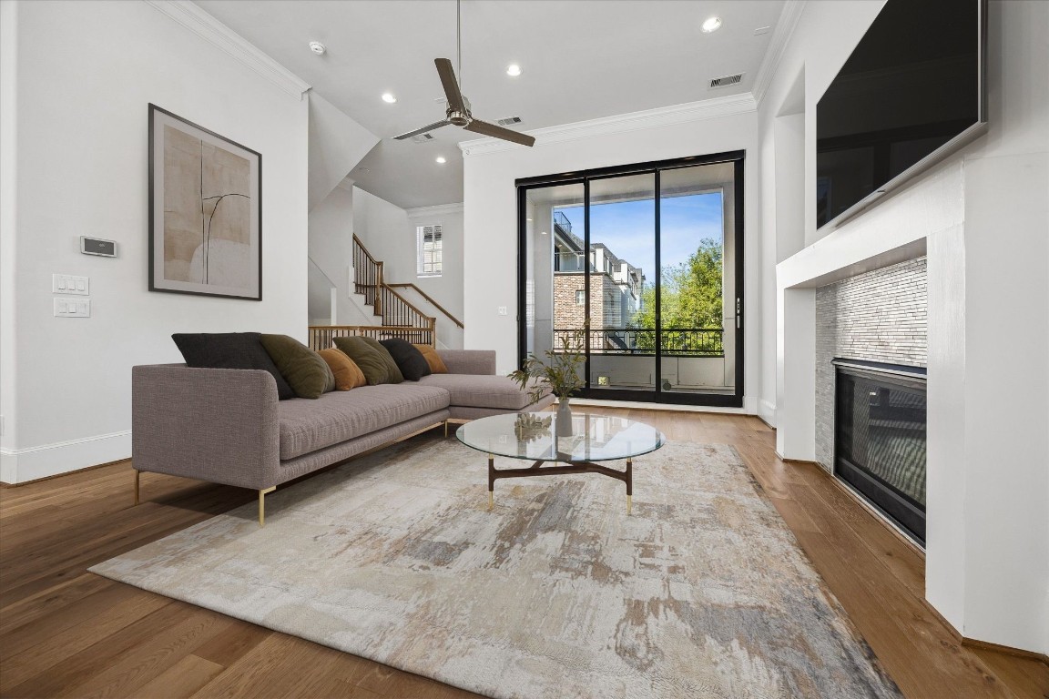 9663 Kings Cross Station Houston, TX 77045 - Photo 8 of 30 a living room with furniture and a fireplace