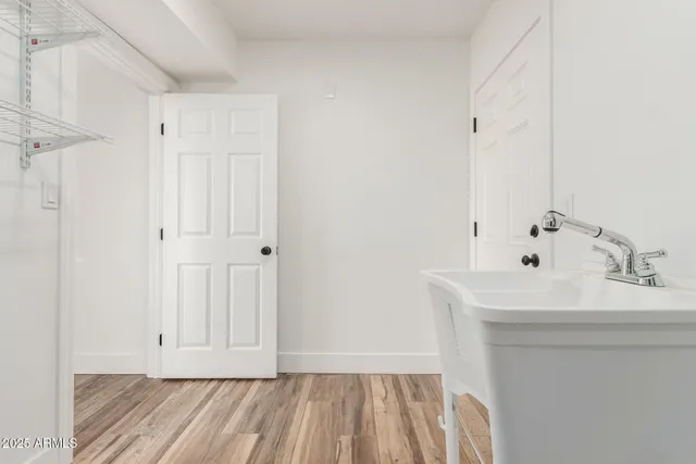 a bathroom with a sink a mirror and shower