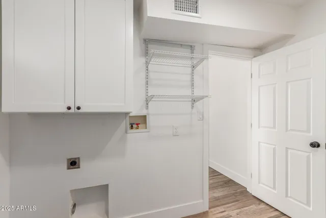 a view of cabinets and wooden floor
