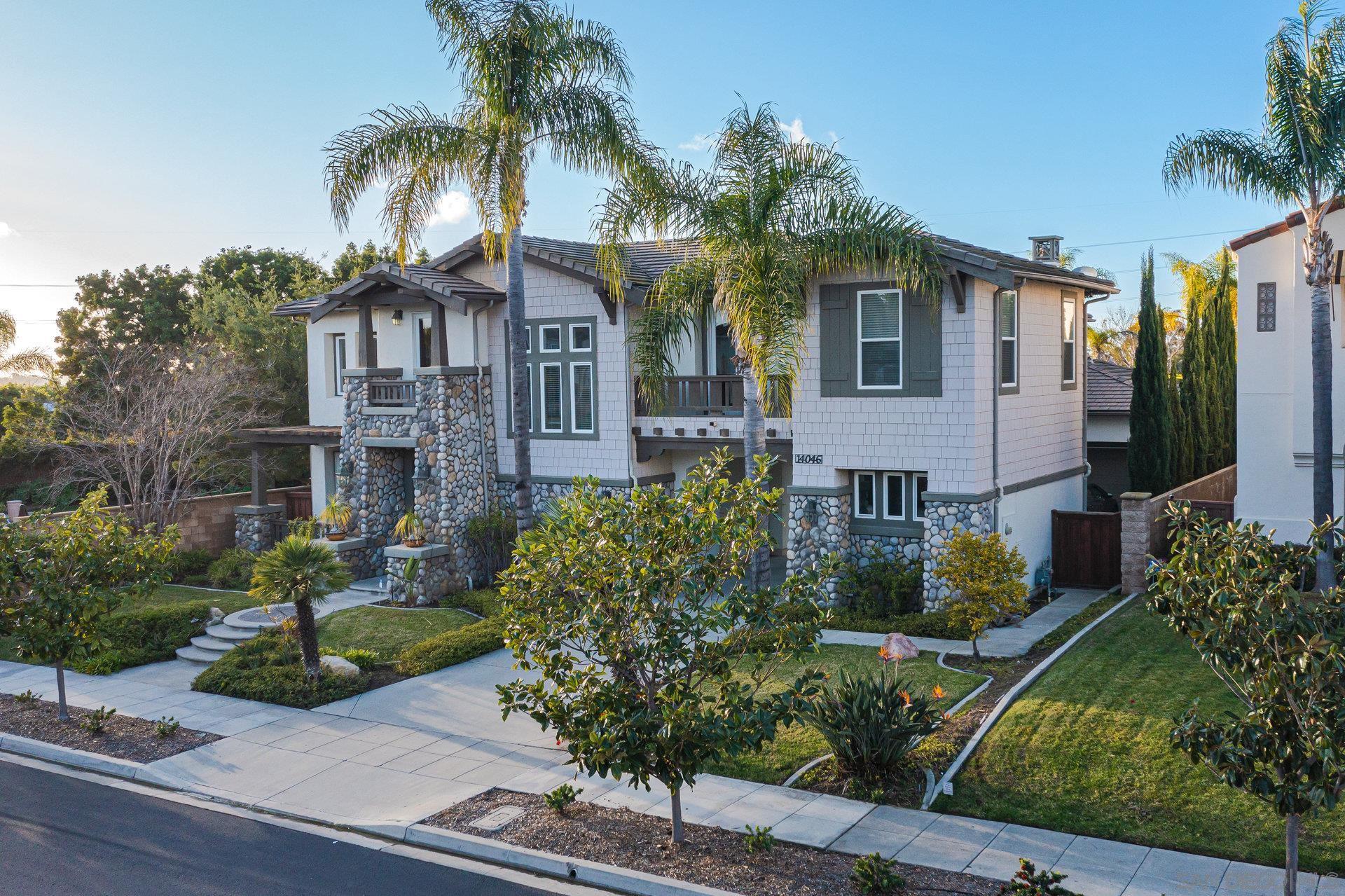 14046 Collins Ranch Place San Diego, CA 92130 - Photo 1 of 39 a front view of a house with yard and green space