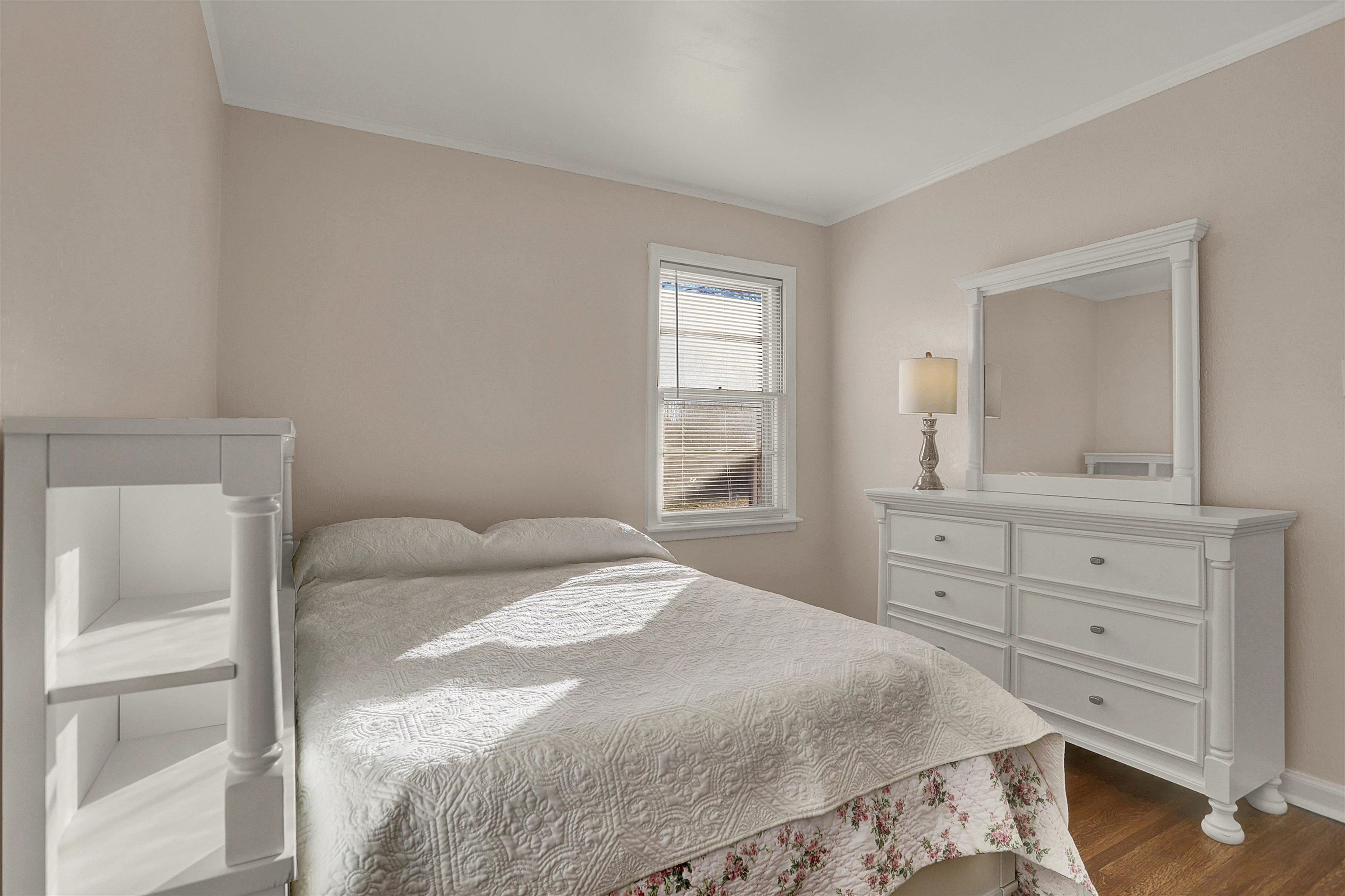 4607 Monaco Road Memphis, TN 38117 - Photo 16 of 25 a bedroom with a bed and a dresser