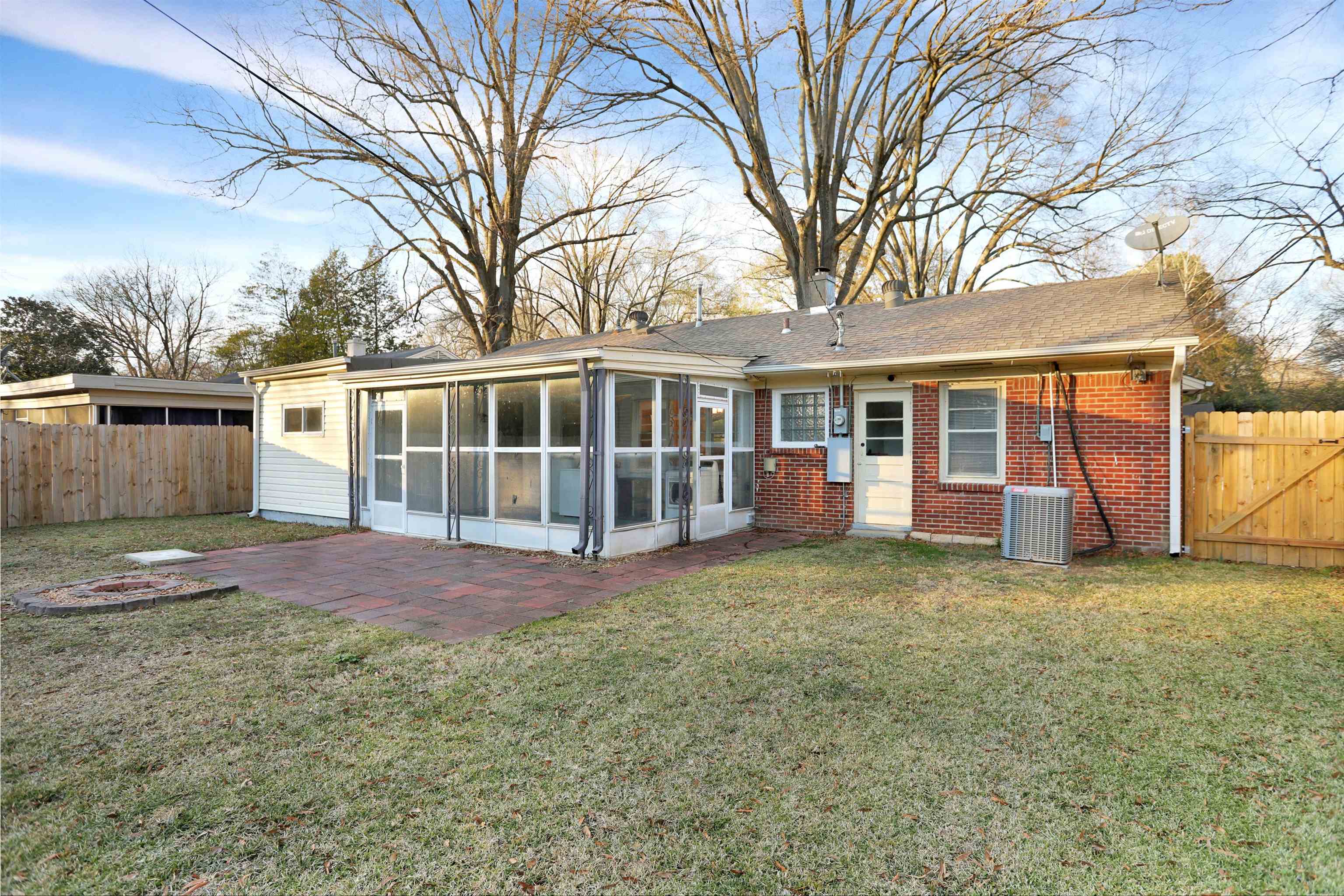 4607 Monaco Road Memphis, TN 38117 - Photo 25 of 25 a view of a house with a yard and large tree