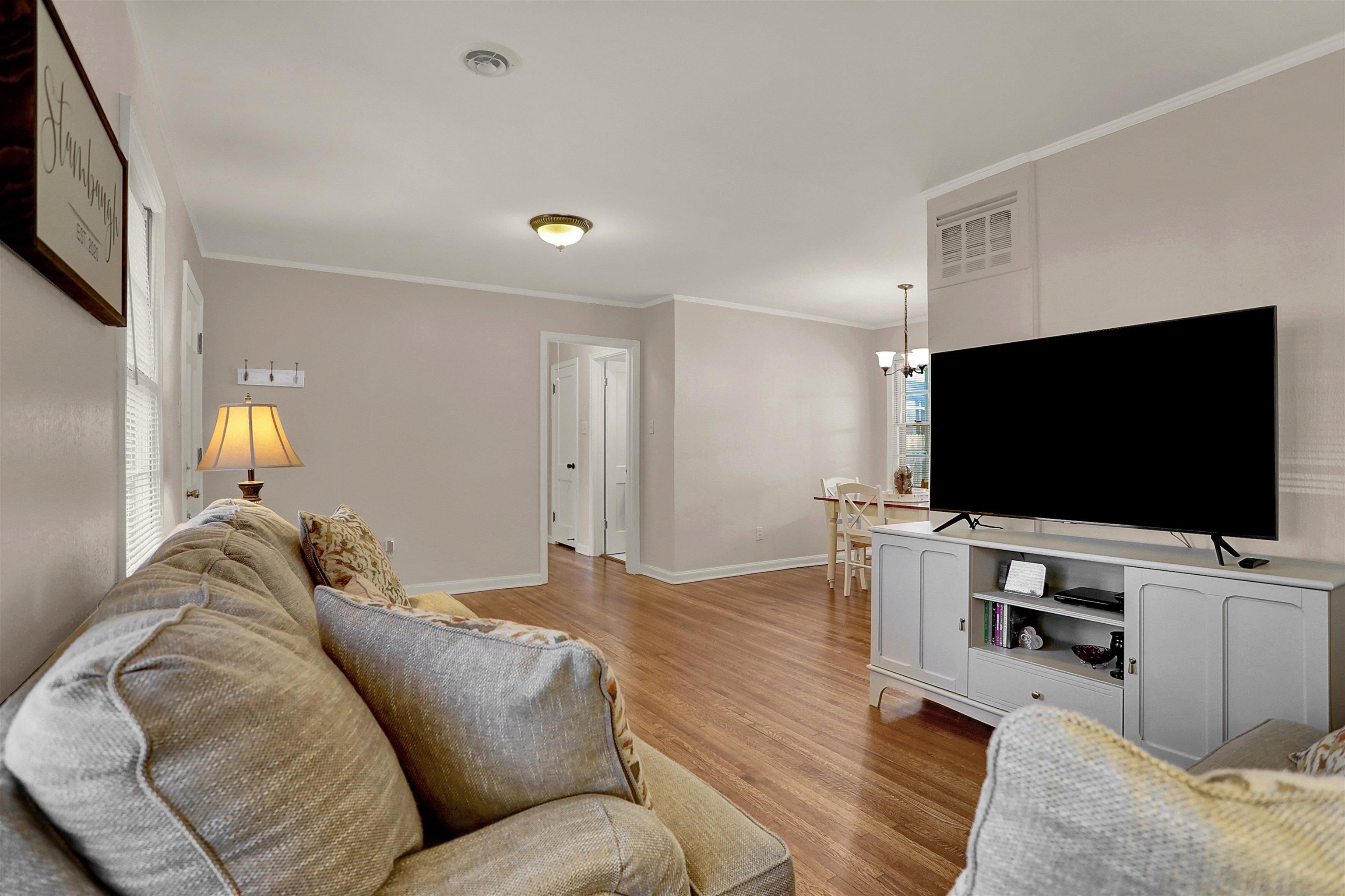 4607 Monaco Road Memphis, TN 38117 - Photo 6 of 25 a living room with furniture and a flat screen tv