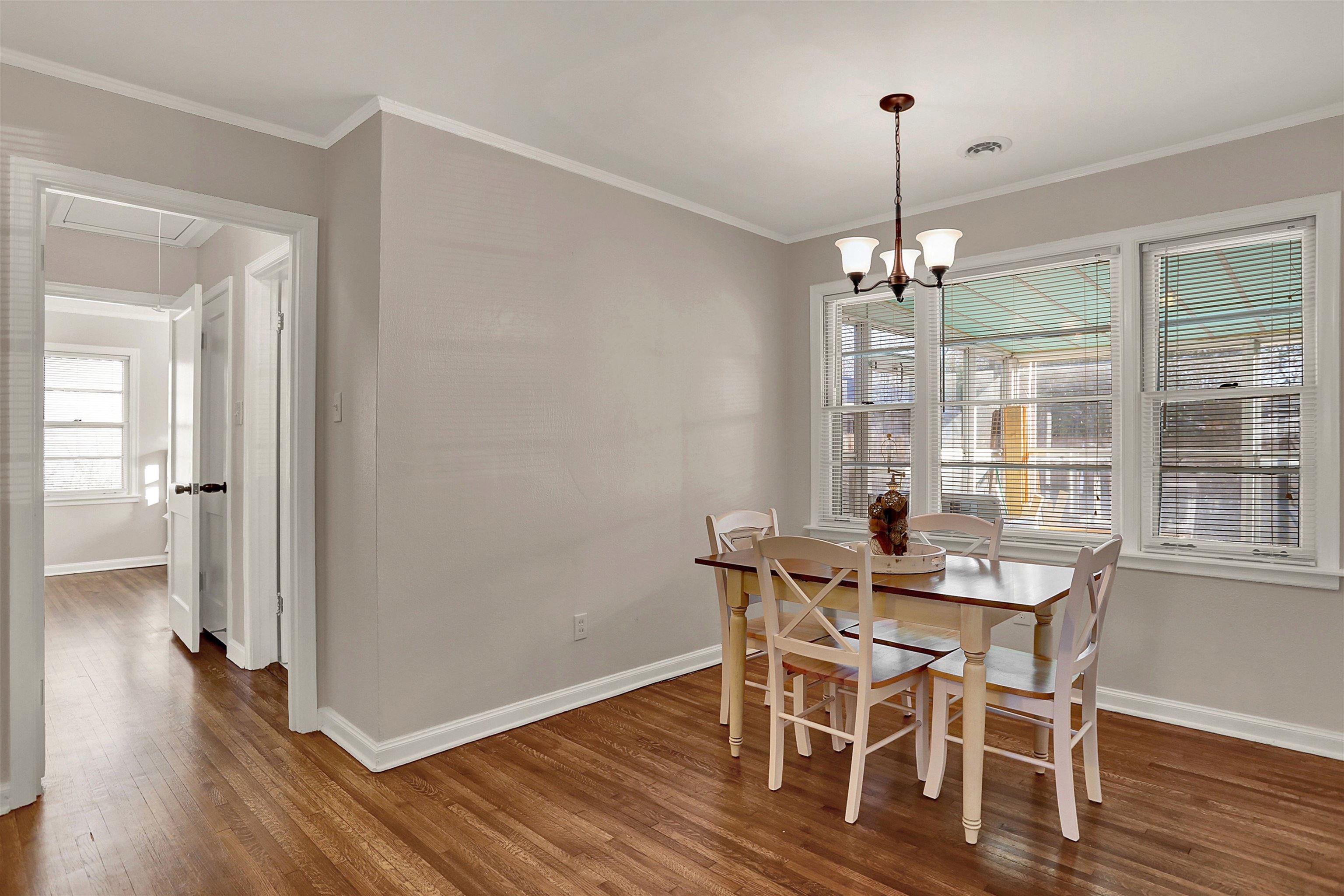 4607 Monaco Road Memphis, TN 38117 - Photo 7 of 25 a view of a dining room with furniture wooden floor and chandelier