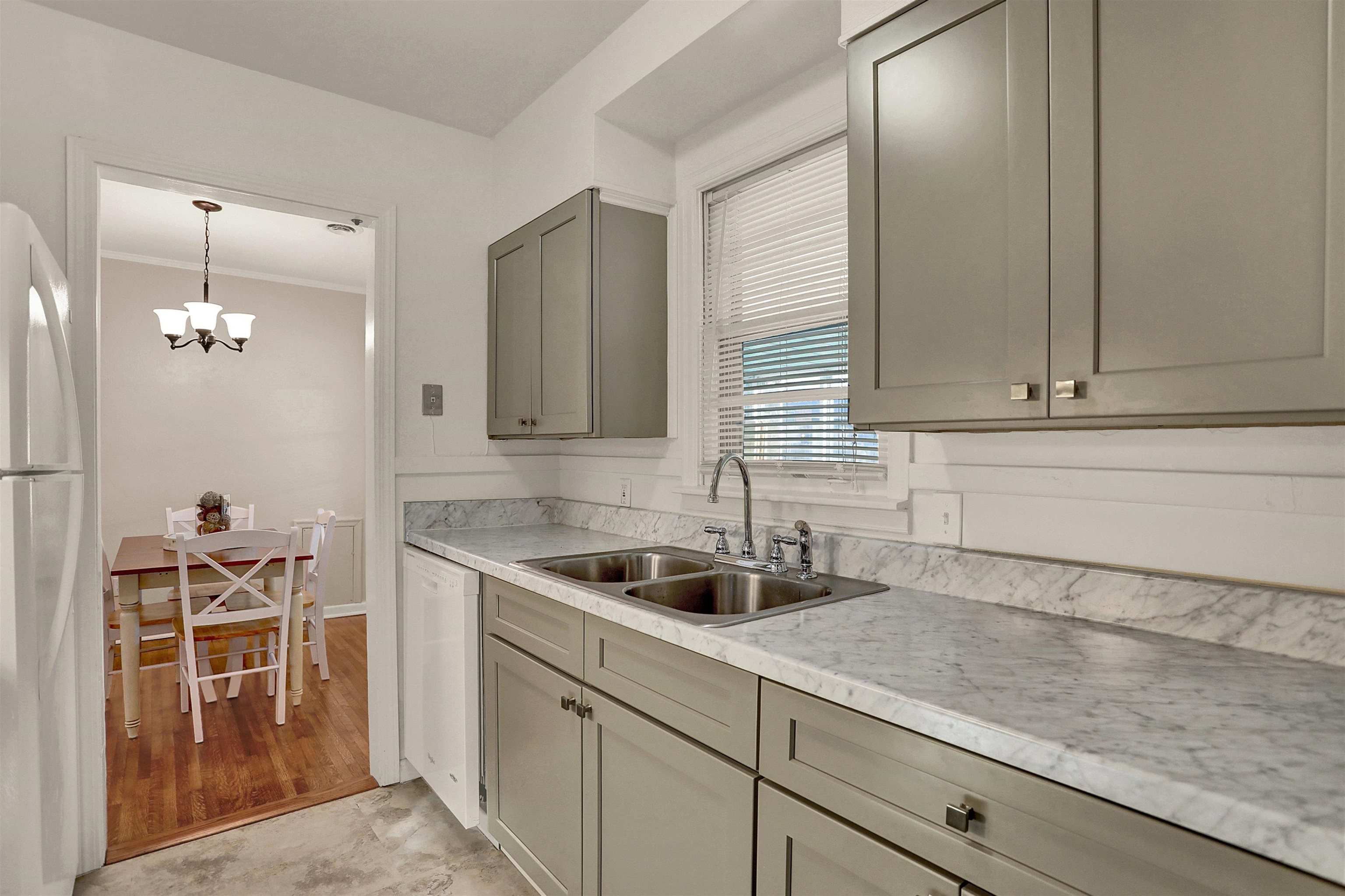 4607 Monaco Road Memphis, TN 38117 - Photo 9 of 25 a kitchen with a sink and cabinets