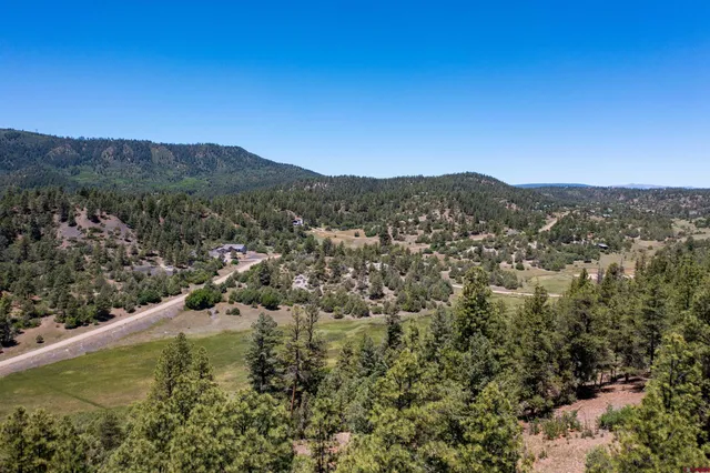 a view of a city with mountains in the background