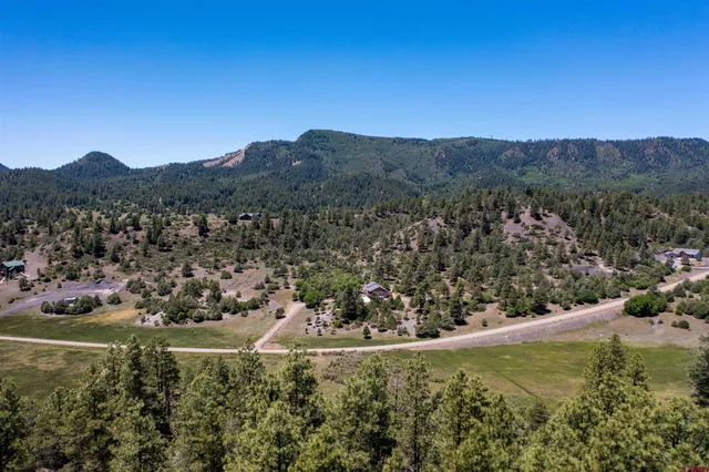 a view of a top of a house with a yard