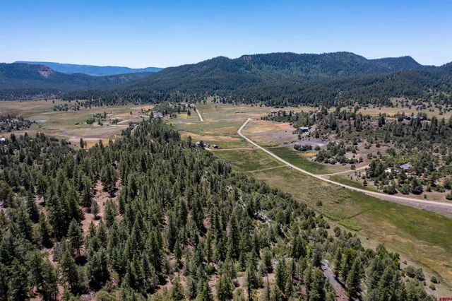 a view of a city with mountains in the background