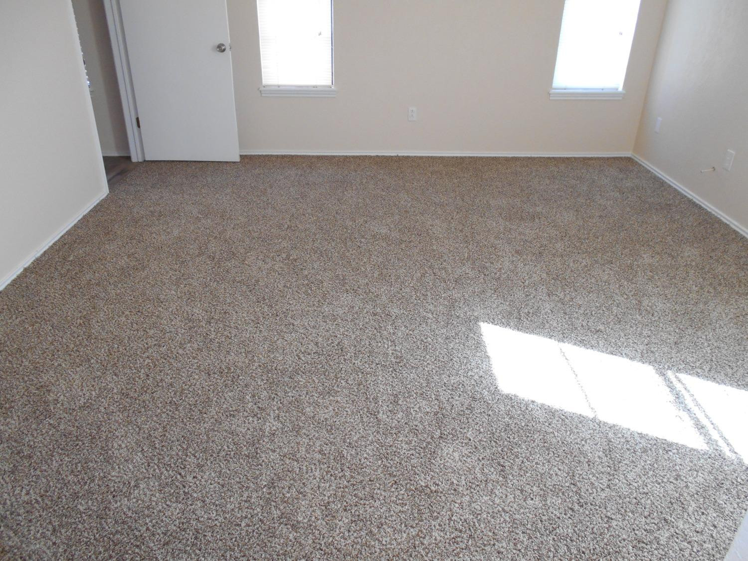5739 Emory Street Lubbock, TX 79416 - Photo 8 of 14 an empty room with a window