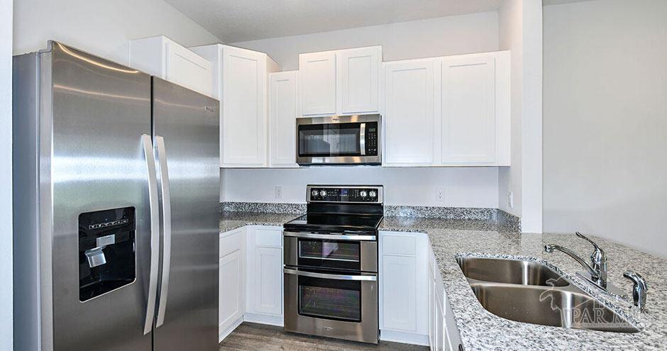 3 Egret Avenue, Unit PALM Santa Rosa Beach, FL 32459 - Photo 11 of 22 a kitchen with stainless steel appliances granite countertop a refrigerator and a sink