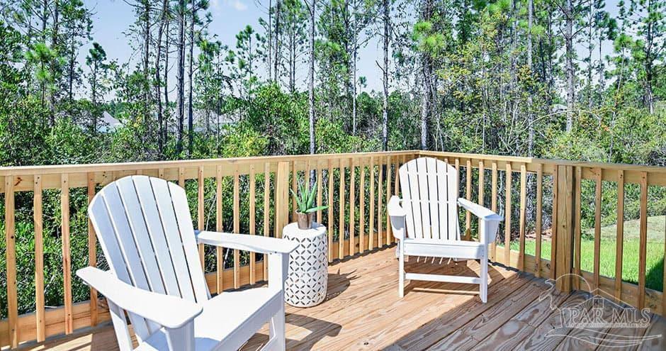 3 Egret Avenue, Unit PALM Santa Rosa Beach, FL 32459 - Photo 19 of 22 a view of balcony with wooden floor and outdoor seating