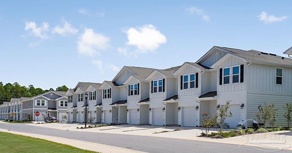 3 Egret Avenue, Unit PALM Santa Rosa Beach, FL 32459 - Photo 3 of 22 a view of a white house with a yard and plants