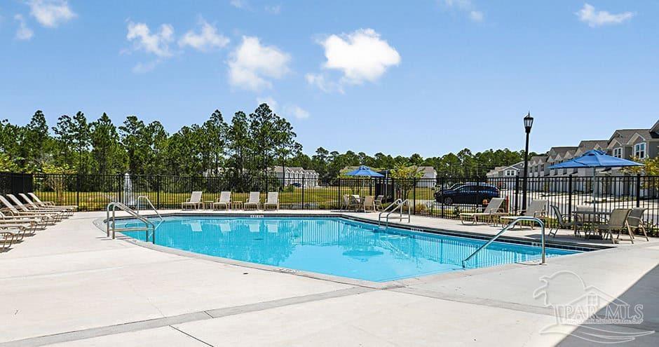 3 Egret Avenue, Unit PALM Santa Rosa Beach, FL 32459 - Photo 9 of 22 a view of a swimming pool and lounge chairs