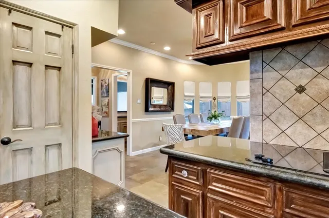 a living room with furniture a flat screen tv and a wooden floor