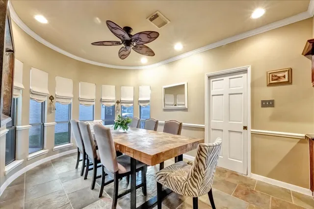 a view of a dining room with furniture and window