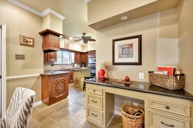 a kitchen with stainless steel appliances granite countertop a stove and cabinets