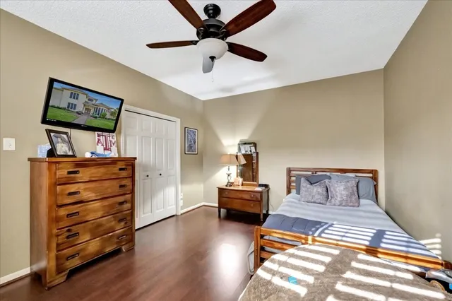 a bedroom with furniture and wooden floor