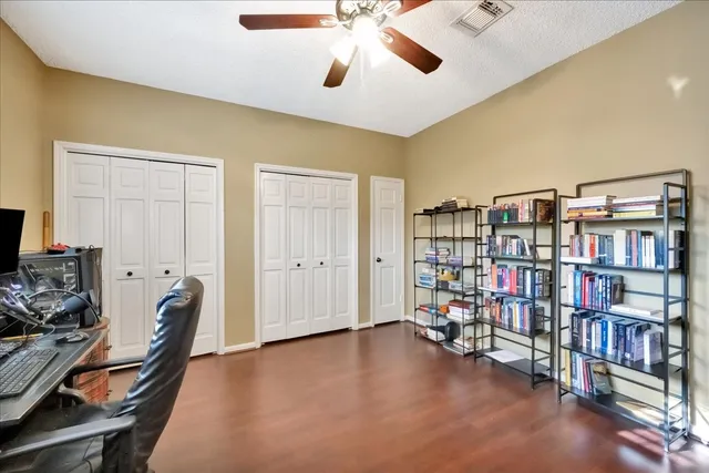 a room with furniture and a book shelf