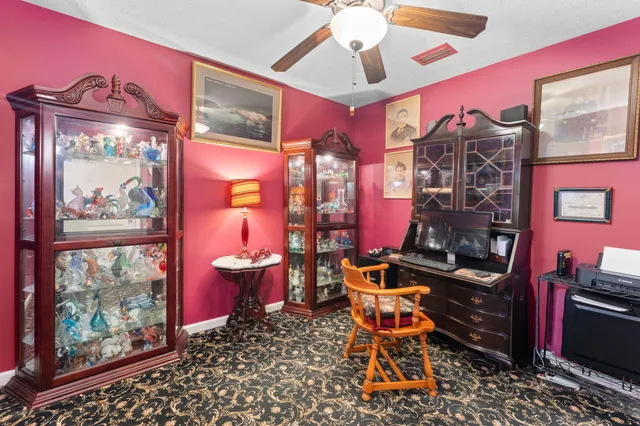 a bathroom with a shower curtain and a window