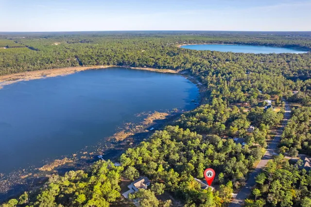 a view of a yard with basketball court