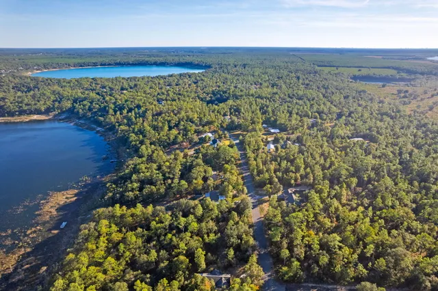 a childrens park with lots of swings slides and swimming pool