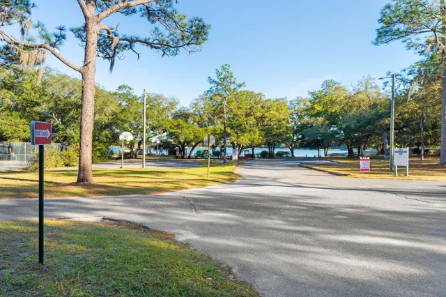 a view of a swimming pool with lounge chairs