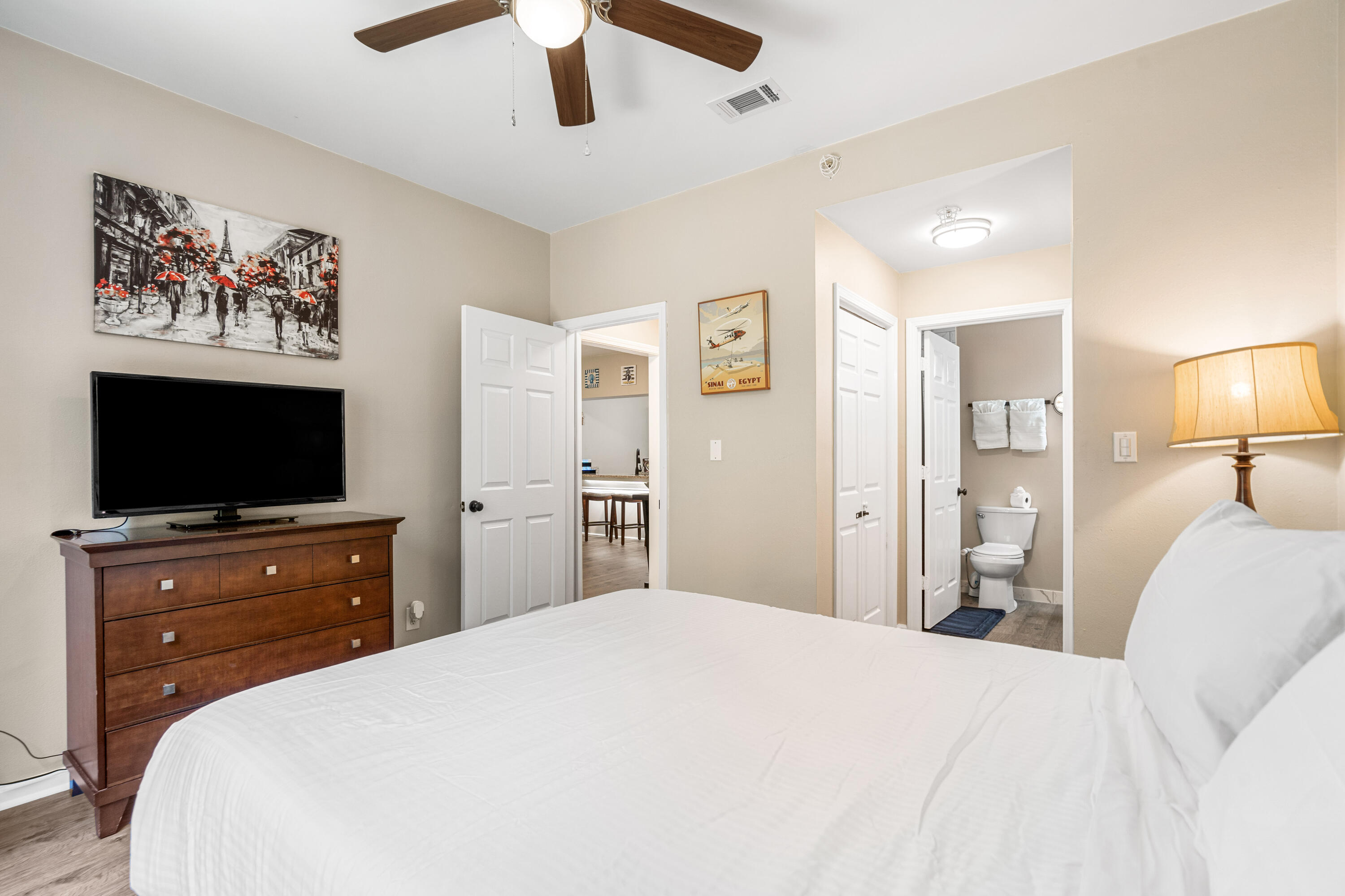 200 Sandestin Lane, Unit 1403 Miramar Beach, FL 32550 - Photo 11 of 37 a bedroom with a bed and a flat screen tv in a dresser