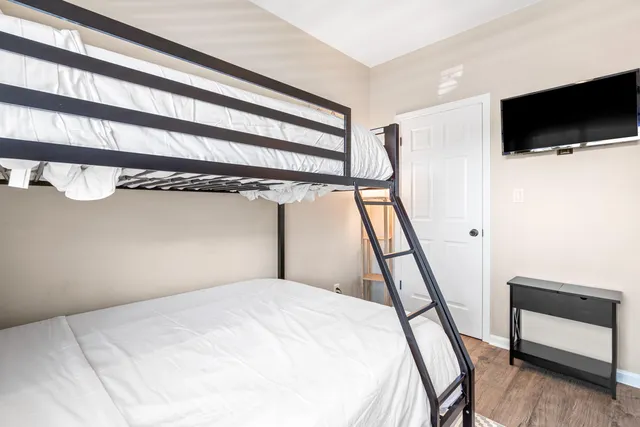 a view of a livingroom with furniture and a window