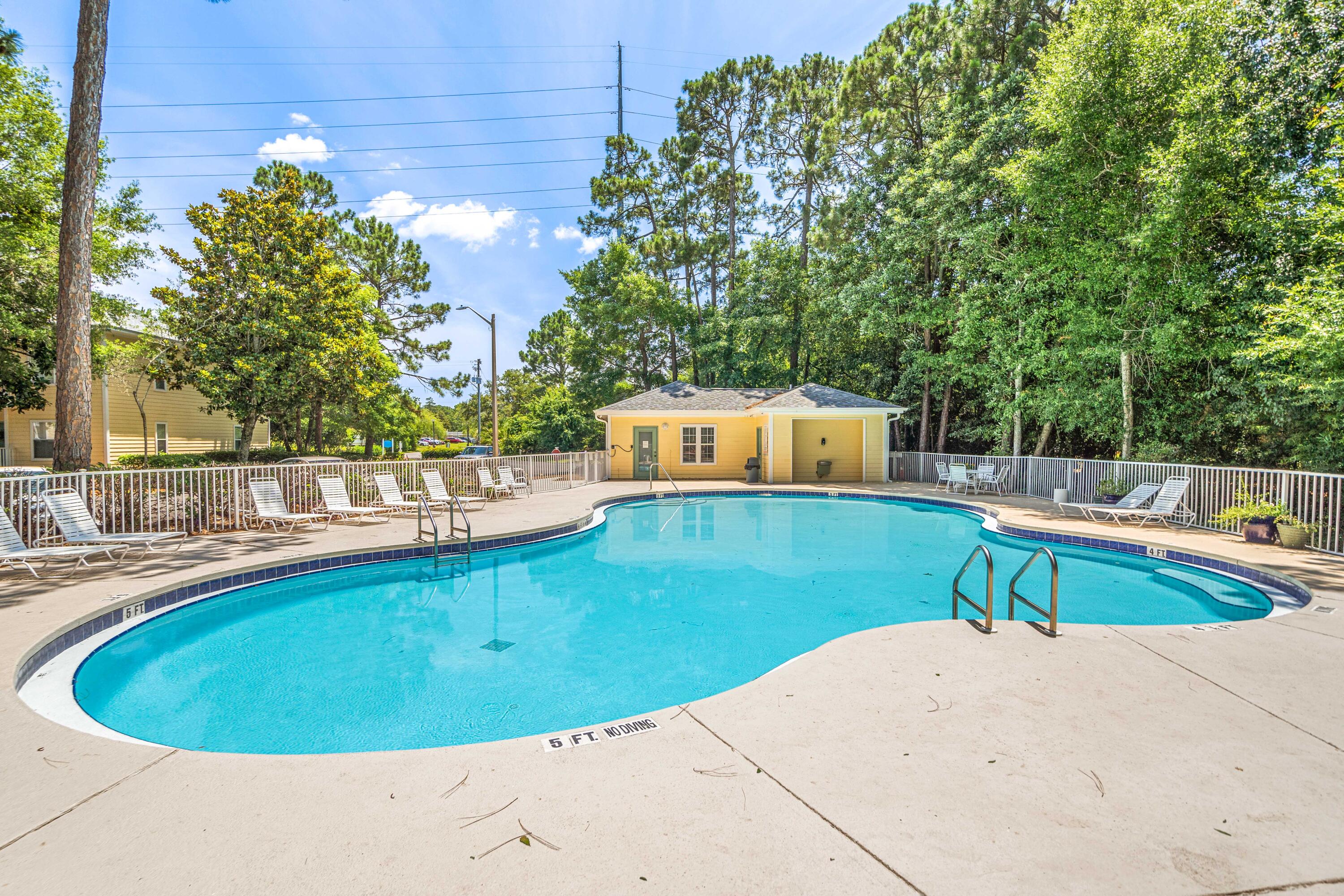 200 Sandestin Lane, Unit 1403 Miramar Beach, FL 32550 - Photo 26 of 37 a view of a swimming pool with a patio