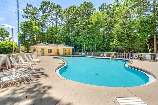 a view of a swimming pool with a patio