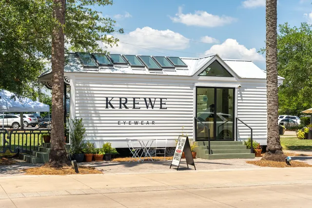 a front view of a house with a road