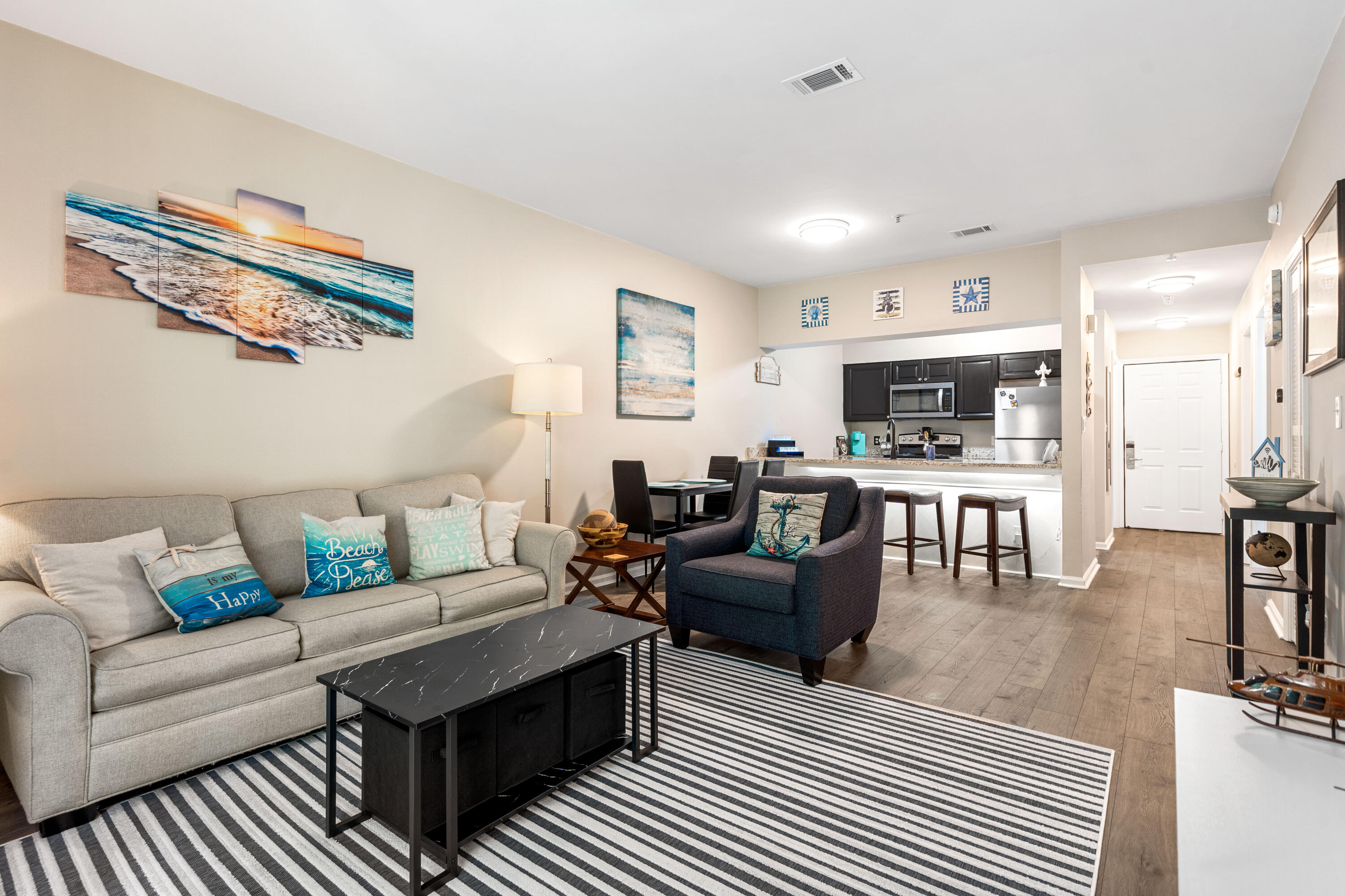 200 Sandestin Lane, Unit 1403 Miramar Beach, FL 32550 - Photo 9 of 37 a living room with furniture and a flat screen tv