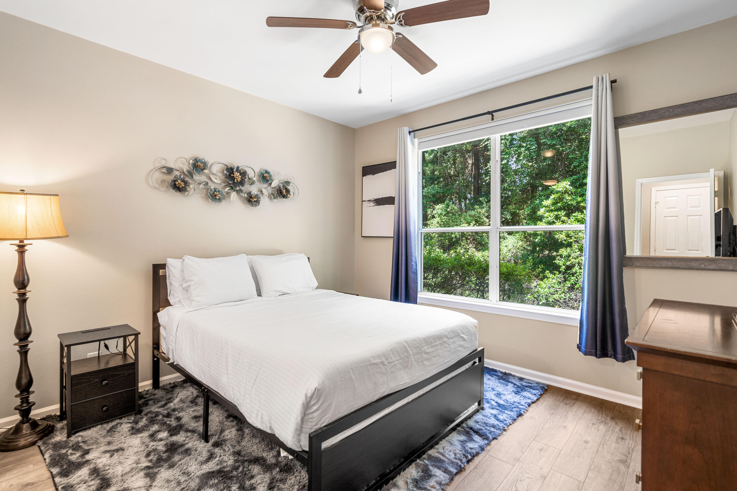 200 Sandestin Lane, Unit 1403 Miramar Beach, FL 32550 - Photo 10 of 37 a bedroom with a large bed and a window