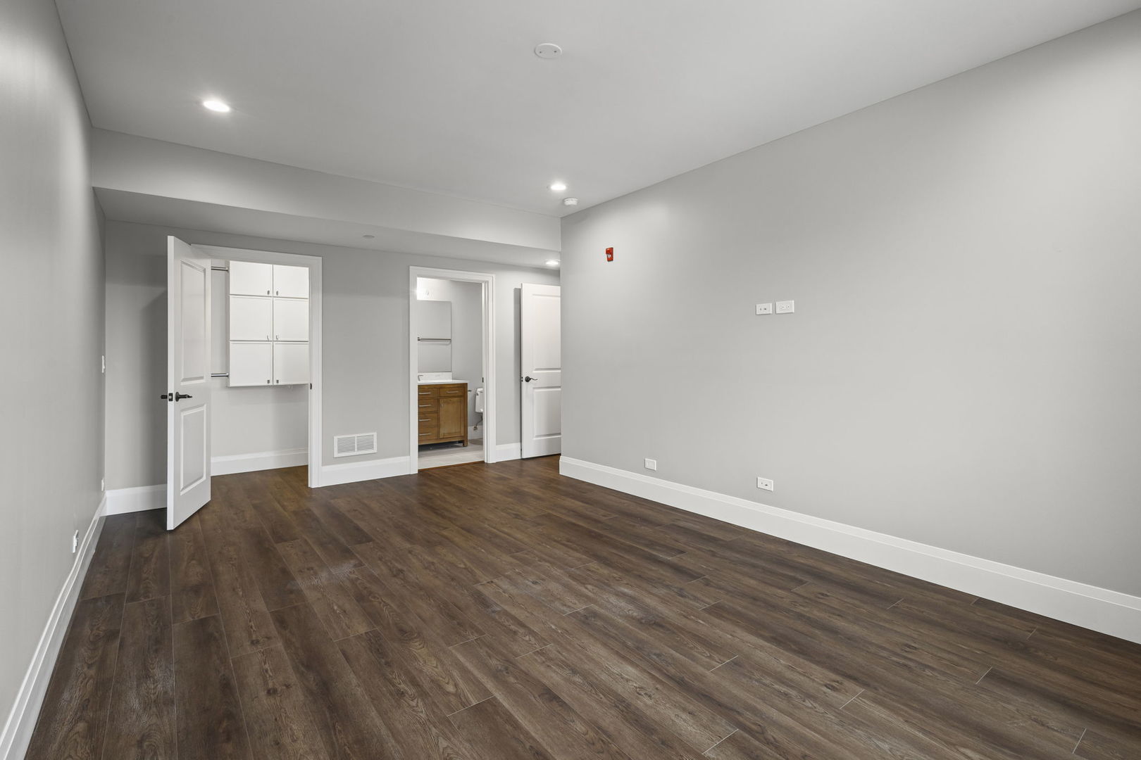 1036 Lake Street, Unit 3N Oak Park, IL 60301 - Photo 14 of 24 a view of an empty room with wooden floor and kitchen