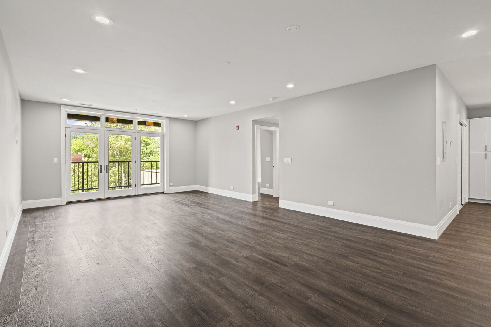 1036 Lake Street, Unit 3N Oak Park, IL 60301 - Photo 6 of 24 a view of an empty room with wooden floor and windows