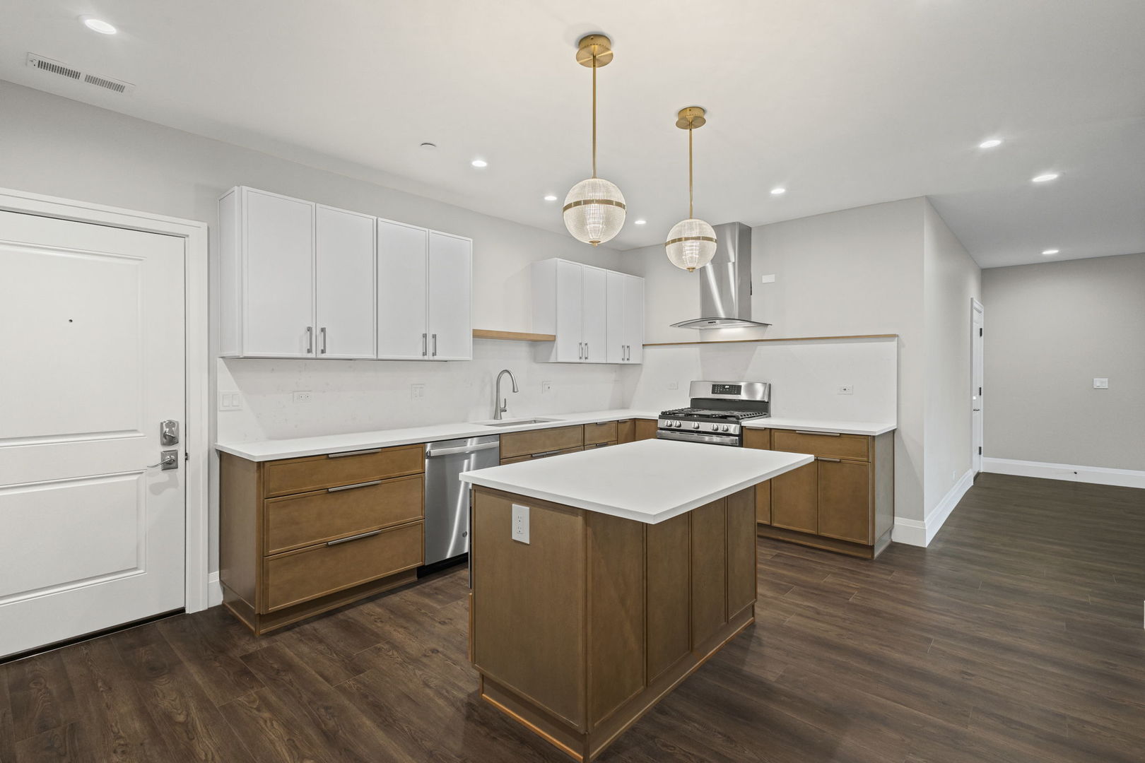 1036 Lake Street, Unit 3N Oak Park, IL 60301 - Photo 10 of 24 a kitchen with a sink stove and wooden floor
