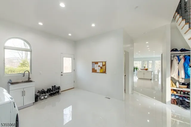 a large bedroom with a large bed and a large window