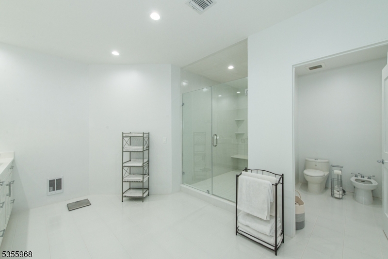 34 West Shore Road Mountain Lakes, NJ 07046 - Photo 23 of 43 a bathroom with a toilet a sink and shower