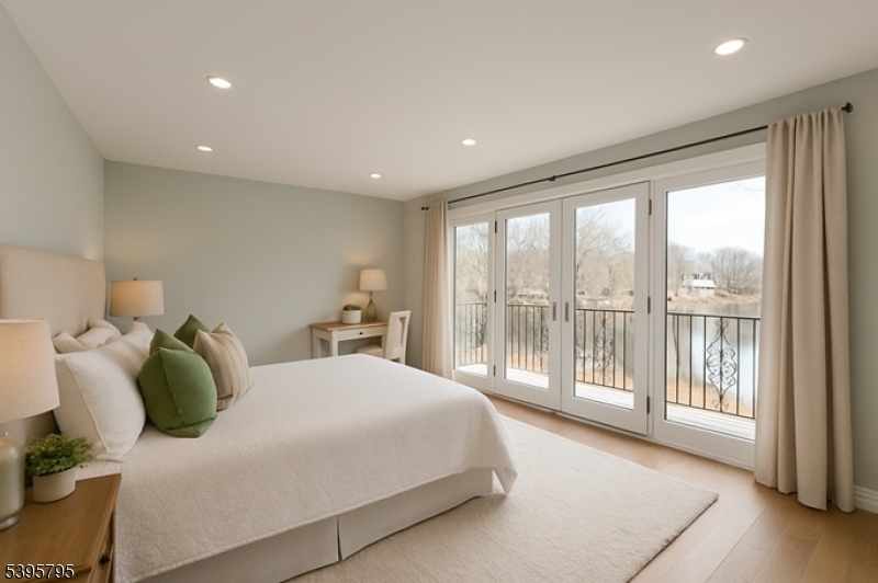 34 West Shore Road Mountain Lakes, NJ 07046 - Photo 26 of 50 a spacious bedroom with a large bed and a large window