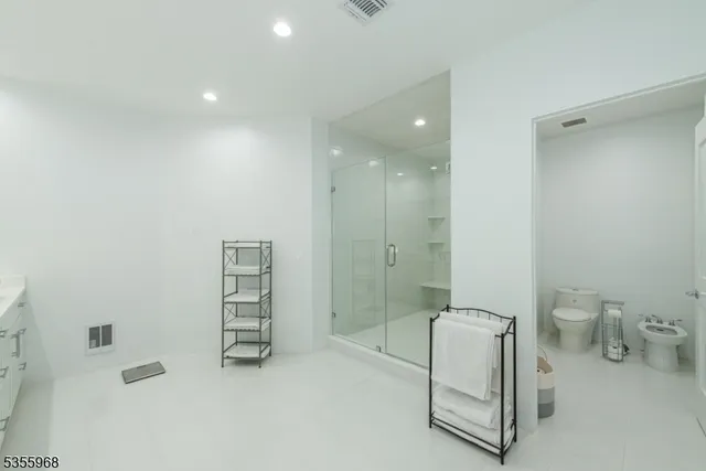 a white bath tub sitting next to a white sink