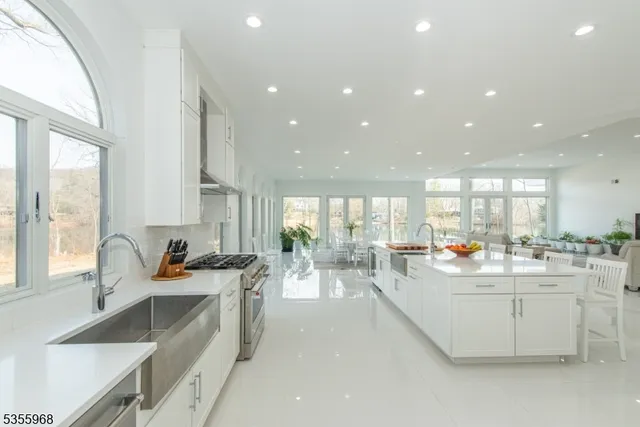 a kitchen with counter top space a sink cabinets and appliances